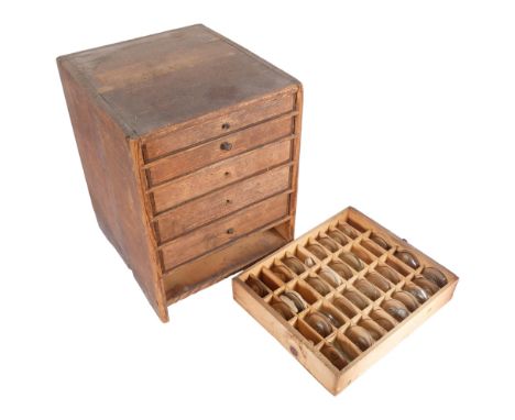 A wooden Horologist/Clocksmith's table-top wooden cabinet, with 6 drawers, drawers have sectional compartments and contain va