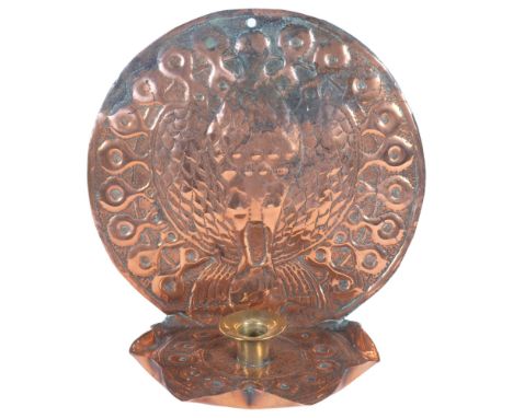 An Arts and Crafts copper and brass chamber stick, with stylised peacock design, H24cm 