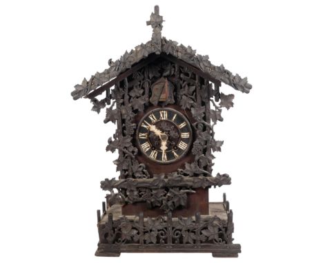 A Black Forest Vintage cuckoo clock, movement in the style of (Beha) A/F condition, pendulum and cuckoo are present, H62cm