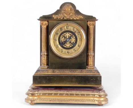 A 19th century French gilt-metal mantel clock of architectural form, 8-day striking movement, applied decoration, on a giltwo