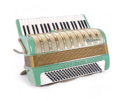 A Hohner, 'Marchesa', piano accordion, 120 button, in original hard shell case, with associated music books.