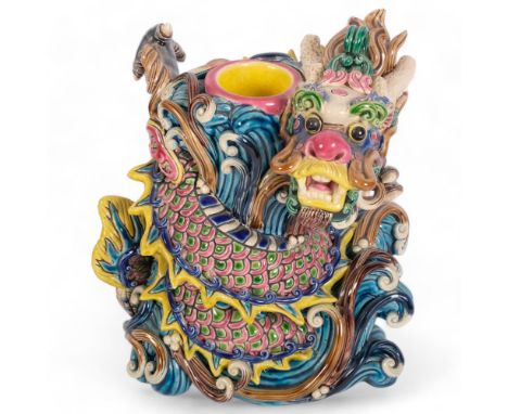 A 20th century Chinese Sancai pottery dog of fo candle stand, H15cmGood overall condition, a few minor chips and light wear o