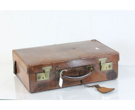 Vintage leather case with brass locks and a fitted interior
