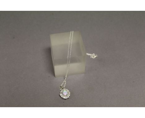 A silver CZ and opal pendant necklace on silver chain