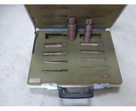 A cased set of industrial milling tools.