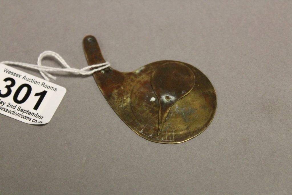 An antique brass spinner, possibly scientific