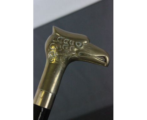 A campaign walking stick with brass eagle head handle 