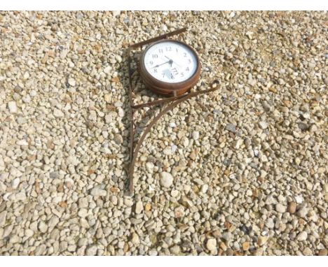 A vintage style bracket clock and barometer.