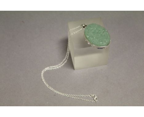 A silver and jade necklace