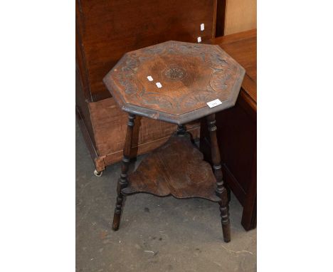 Late Victorian carved oak lamp table
