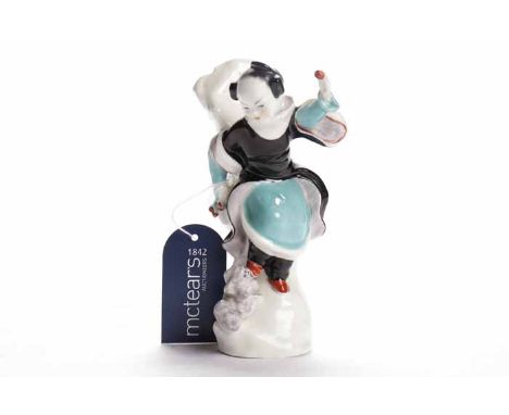 ROYAL WORCESTER FIGURE
modelled as an oriental figure offering a treat to a dog, black printed mark, 334S, 16.5cm high