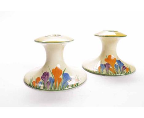 PAIR OF CLARICE CLIFF BIZARRE CROCUS PATTERN CANDLESTICKS
circa 1931,  hand-painted with crocuses with yellow and green bandi