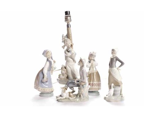 COLLECTION OF LLADRO FIGURES
including two young girls, a milkmaid, a young man resting on a tree trunk, each with blue print