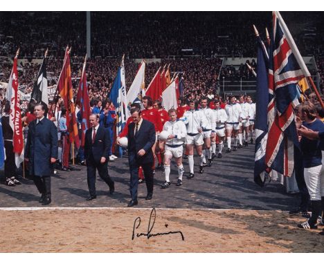 Autographed Peter Lorimer 8 X 6 Photo: Col, Depicting Leeds United Manager Don Revie Leading His Team Out Onto The Field Of P