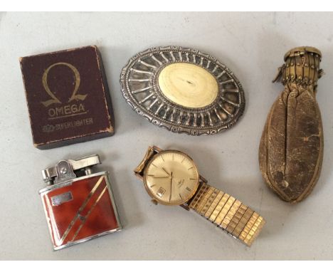 An Omega petrol lighter with original box, a silver and Ivory mounted belt buckle, Rotary wristwatch and a leather miser's pu
