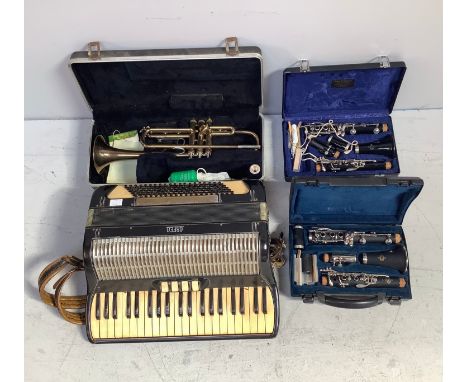 Two various Buffet Crampon B12 clarinets with spare reeds and cork grease, in fitted and lined hard cases, together with a 'B