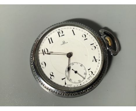 A white metal open-faced Omega pocket watch, the white enamel dial with Arabic numerals denoting hours, subsidiary seconds di