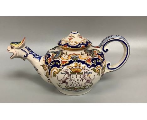 A French Faience/Quimper pottery armorial teapot, one side decorated with a coat of arms, the spout modelled as a stylised my