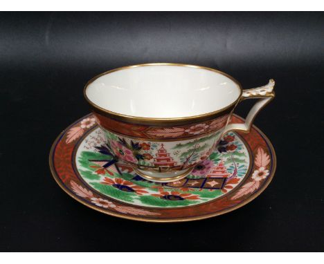 A Worcester Flight Barr &amp; Barr porcelain tea cup and saucer gilded and decorated in a 'Japan' palette with exotic birds i