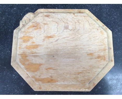 An octagonal cheeseboard by Robert 'Mouseman' Thompson with trademark carved mouse, 32cm diam 