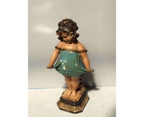 A vintage plaster figure of a bashful girl, raised on shaped pedestal base, 58cm tall 