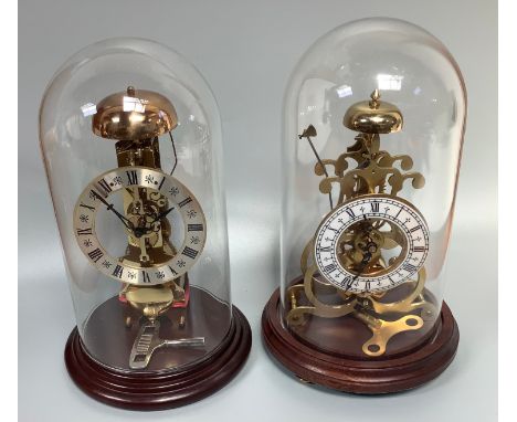 A West German anniversary clock with silvered dial, black Roman numerals, glass dome cover on circular wooden base, 29cm high