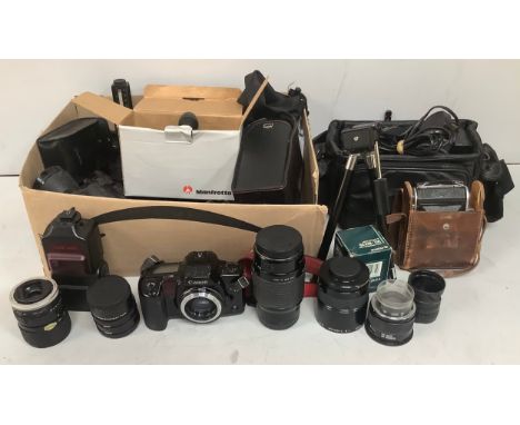 A large quantity of camera equipment including a Canon EOS 10 camera, Canon video recorder in case, Fuji camera, Minolta AF35