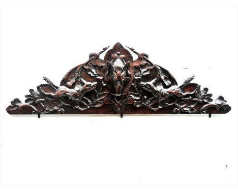 HUNTING LODGE DOORWAY PEDIMENT , early-mid 20th century, Austrian, a carved hunting lodge doorway pediment with boar's head d