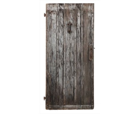CHURCH DOOR , 19th century, with a knocker and a latch, 200cm high approximately&nbsp;Provenance: From the Harry Diamond 'Le 