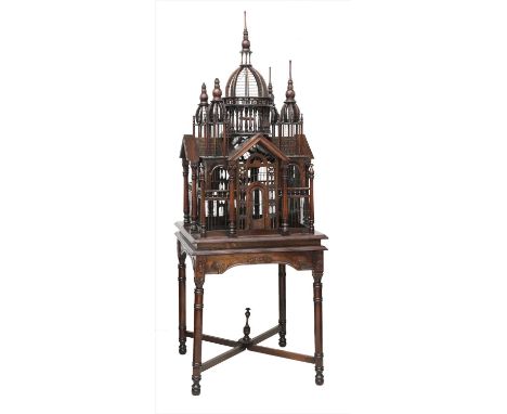 ARCHITECTURAL BIRDCAGE, 20th century, a 19th century-style Continental wooden architectural birdcage, with pagoda top and col