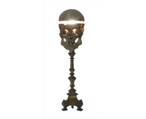 HUMAN SKULL LAMP, late 19th century, an unusual human teaching aid skull with later brass table light mount, 57cm high