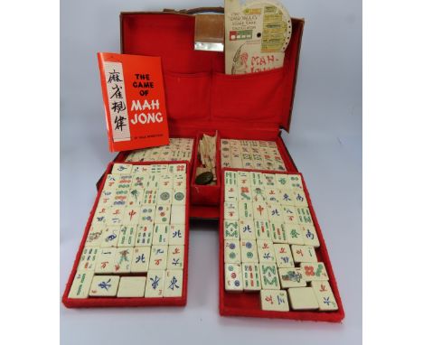 Vintage Mahjong tiles set in leather case.