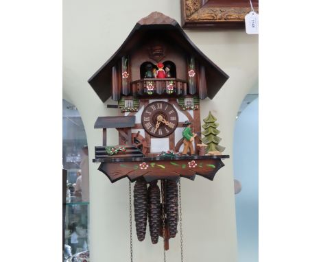 Modern German black forrest automaton cuckoo clock, (runs intermittantly ).