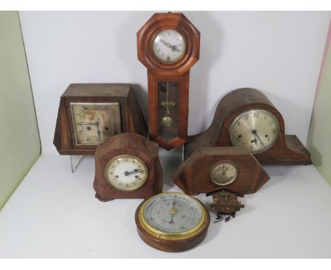Collection of vintage clocks including a Smiths Bakelite, small cuckoo clock and a barometer.