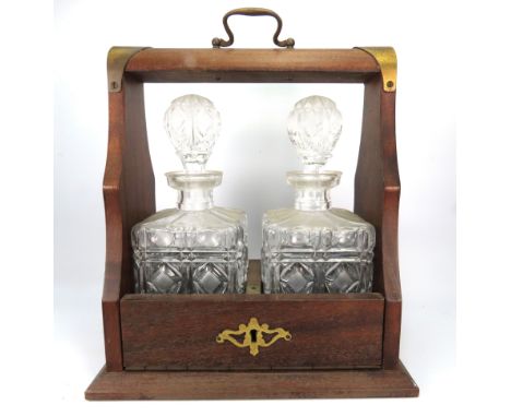Two bottle decanter tantalus with key.