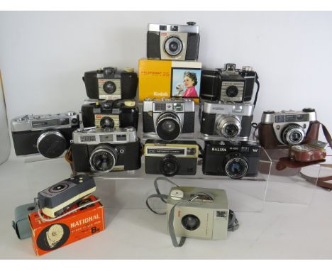 12 Vintage 35mm cameras, names include Kodak, Voigtlander, Cornet, etc. See photos.