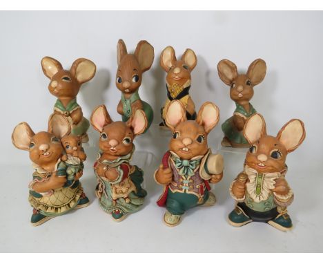 Eight larger Pendelfin rabbit figurines.