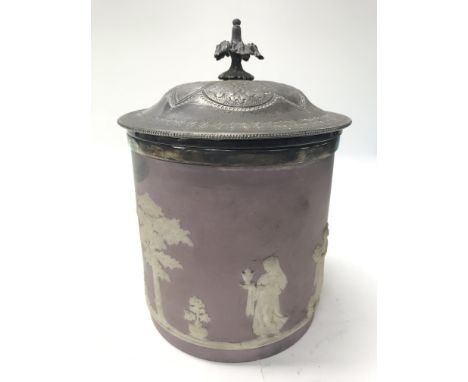 A lavender hue jasperware wedgewood biscuit barrel.