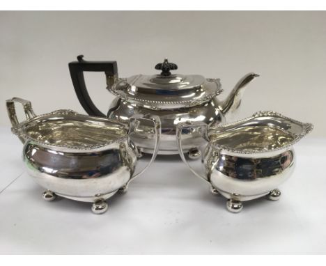 A three piece silver tea service, Birmingham hallmarks, approx 754g.