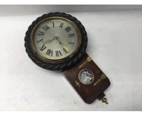 A large mahogany cased wall clock