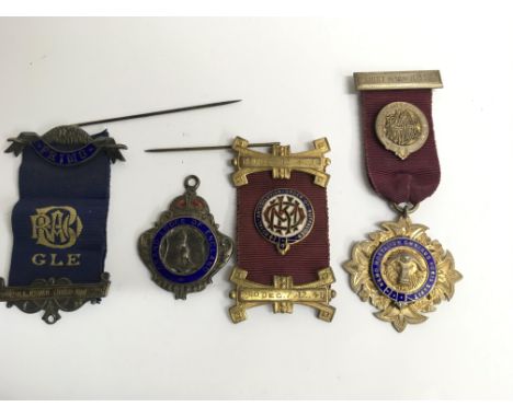 Four silver gilt and enamel Buffalo medals