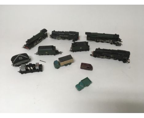 A collection of unboxed OO gauge Hornby trains and other vehicles.