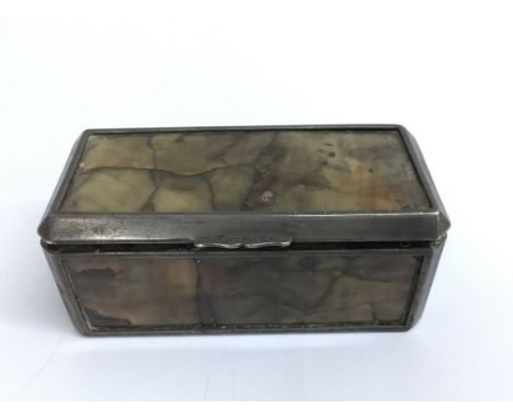 A 19th century polished hard stone trinket box mounted in white metal.Approx 5x10cm long