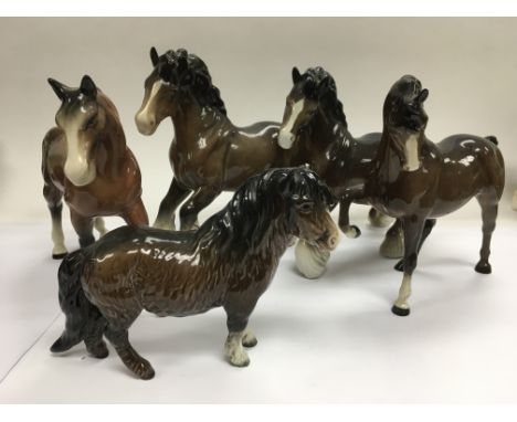 A collection of five ceramic figures of horses including Beswick examples.