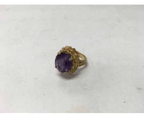 A 9ct gold amethyst ring. Weight approx 10.1g, size approx N