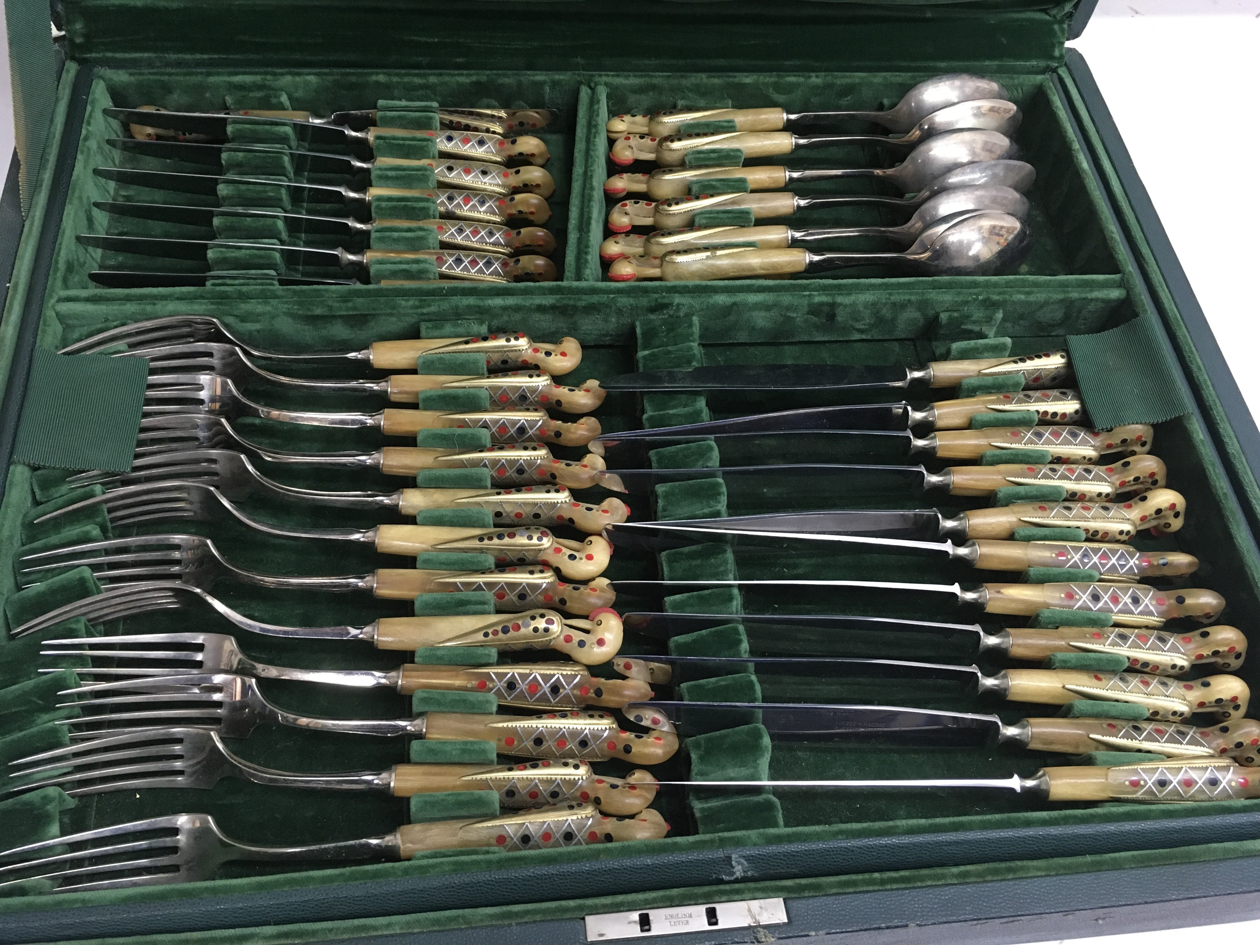 A large canteen of middle eastern cutlery of unusual design having bird