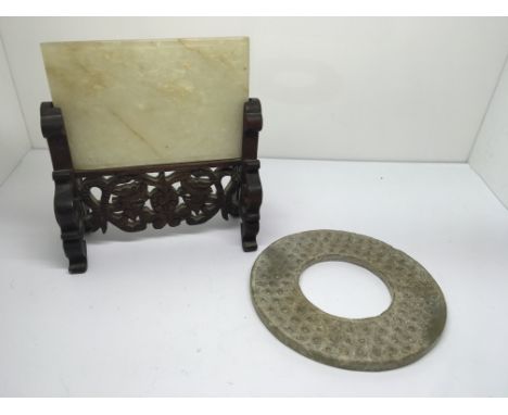 A miniature white jade plaque, finely carved with insects presented with carved wood stand, character mark to reverse, and a 