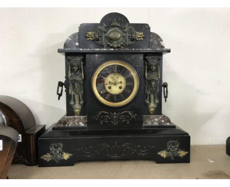 A large Art Deco mantel clock with marble accents
