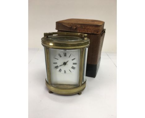 A brass cased carriage clock with original travelling case a/f and key.