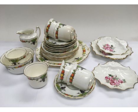 A hand painted on transfer tea service and three shell shaped Aynsley dishes.